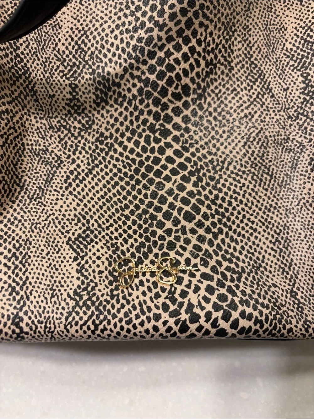 Jessica Simpson Black and Beige Animal-Print Satchel